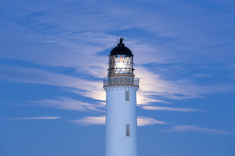 Moon behind the Lighthouse